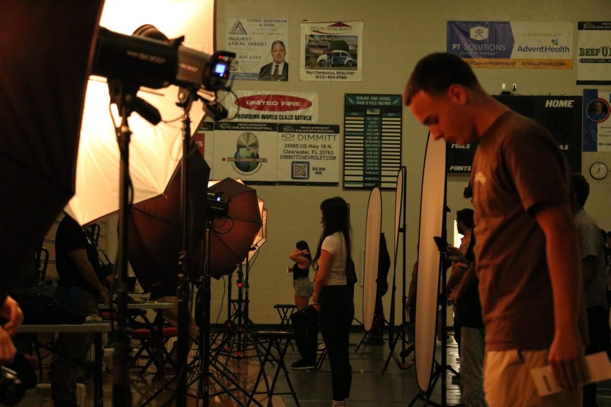 Student lining up to have their picture taken on Picture Day.