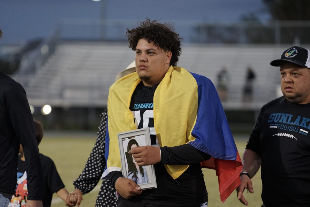 Sebastian Perez walks the field with his family for Senior Night. 11/1/24