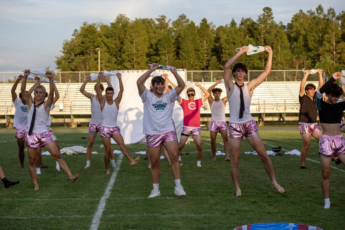 Senior Noah Downey performing during Powder Puffs half time to "Its Raining Men". 