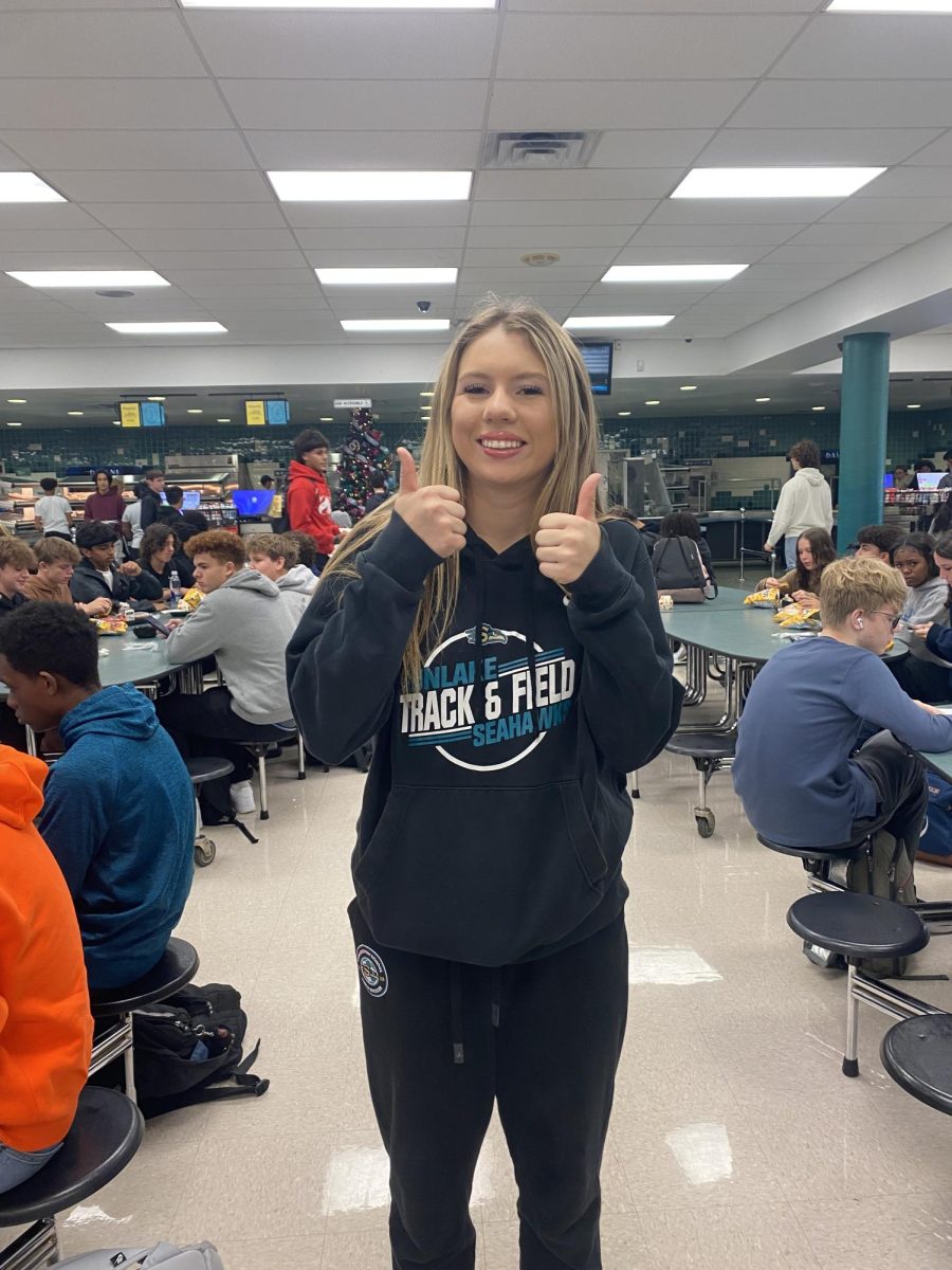 Larissa can be seen standing with her thumbs up. She says that she,
"loves Veteran's Day and is grateful for everyone who serves."