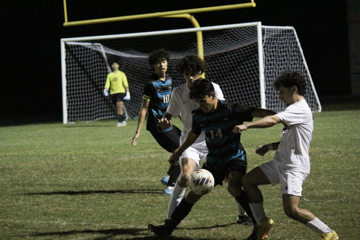 Brandon Loeffler playing in the varsity boys soccer game.