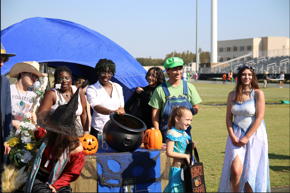 Senior Caleb Cueva (Luigi costume) was helping volunteer with Drama Club by giving out candy. "Even if I wasn't president, I would do this event because it's a really fun time to hang out with friends and get into the Halloween spirit." He said.