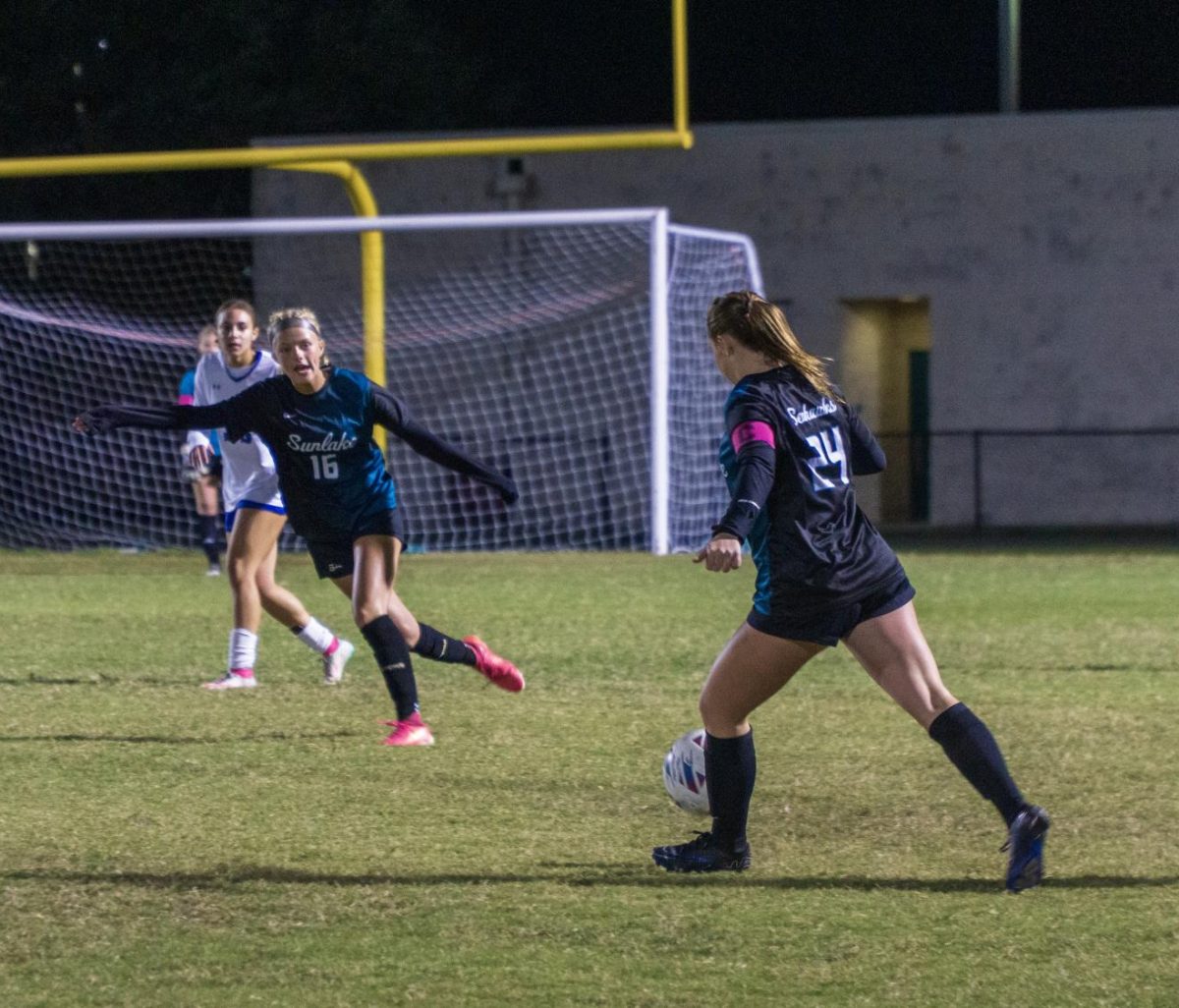 Charlotte Stryker, Freshman, blocking an East Lake player while getting open for a pass from her teammate. Charlotte says "playing the whole time for an extremely important game was an amazing moment to experience.". Week of 12/2-6