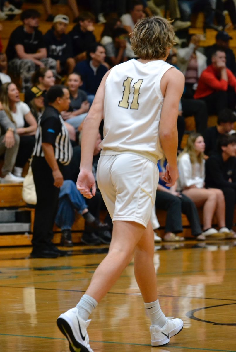 Photograph of Brayden Eskandari playing basketball for Sunlake High School against Dunedin High school. Taken by Zoey Fry on November 17, 2024. 