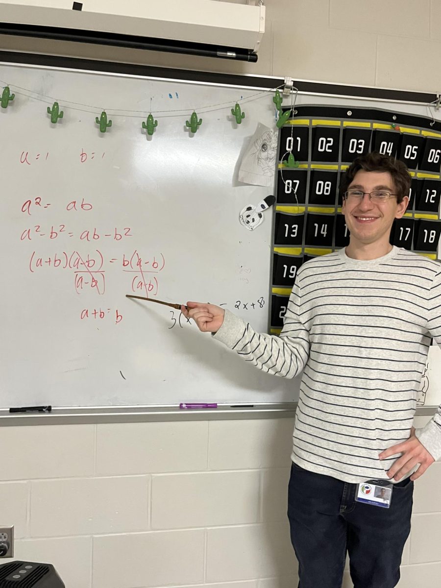 Mr. Coffey shows off a math equation.
Mr. Coffey is pointing to an equation he helped a student with.