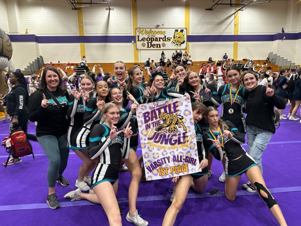 The cheerleading team can be seen posing with the first place banner. The picture was taken at Hernando High School's competition. Zoe says that she is "very proud of the team!" 