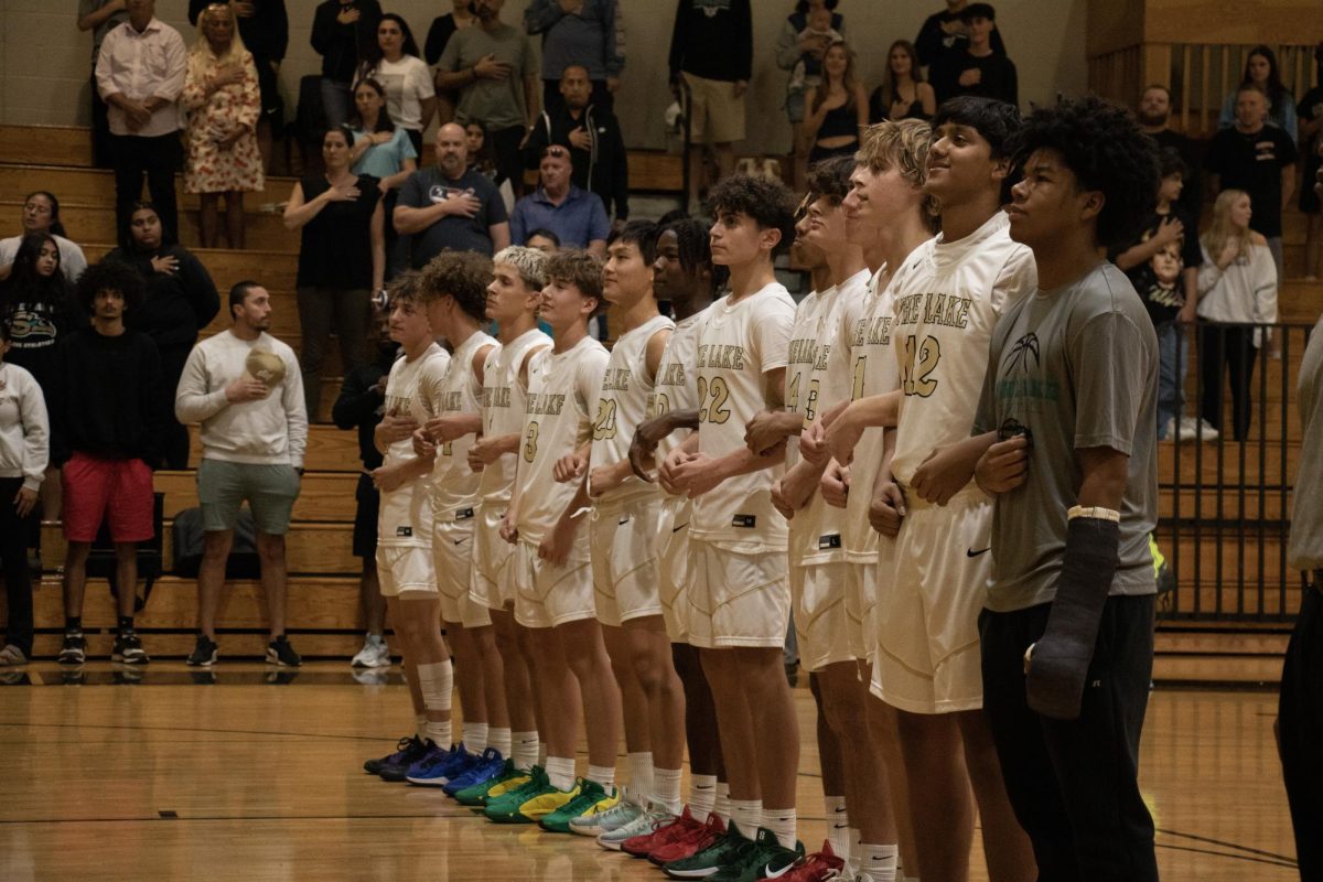 The Sunlake Boy's Basketball team lined up together during the National Anthem moments before they played against the Dunedin Falcons. 