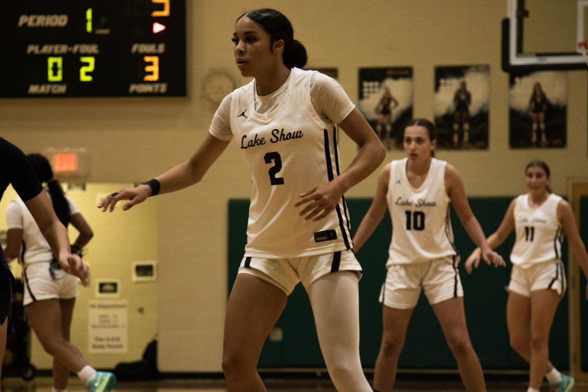 Aniya Collington (11th grade) in an defensive Basketball position.
