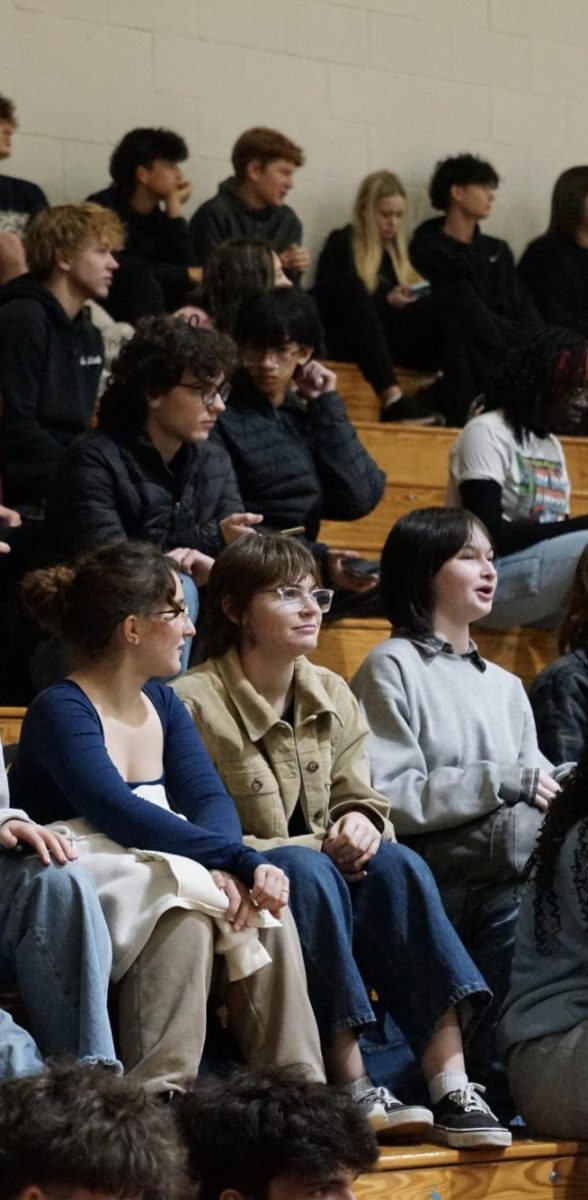 Meaghan Ballard (Middle); Junior, enjoying the pep rally with her friends. Meaghan, "hopes the teams do well," during their upcoming seasons.