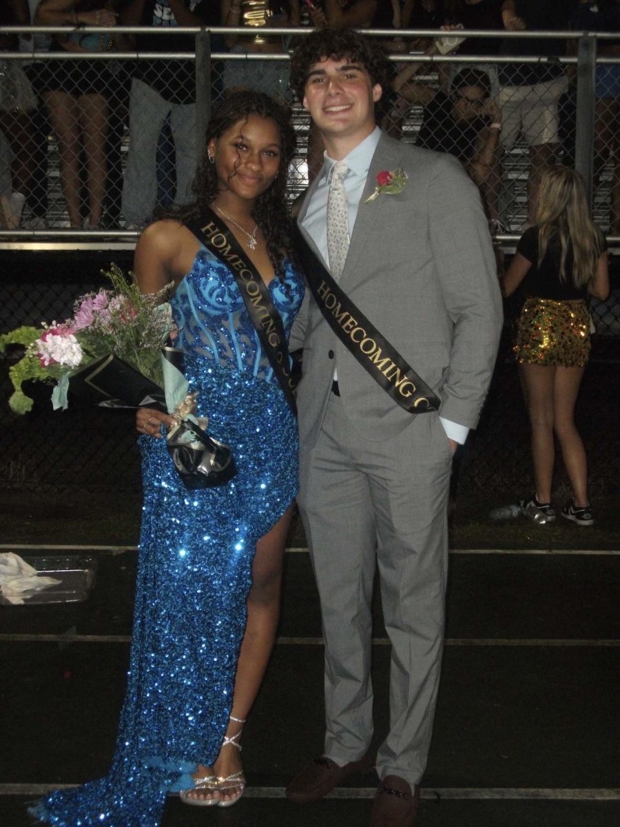 Paige can be seen on her homecoming court date. Paige says that she is "going to remember this moment forever". The picture was taken at the Sunalake's homecoming football game. 