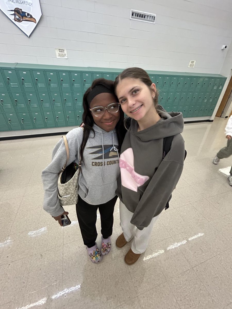 Sophomore's Leah Osikowicz and Lieanna Clark excited to see eachother in passing period.