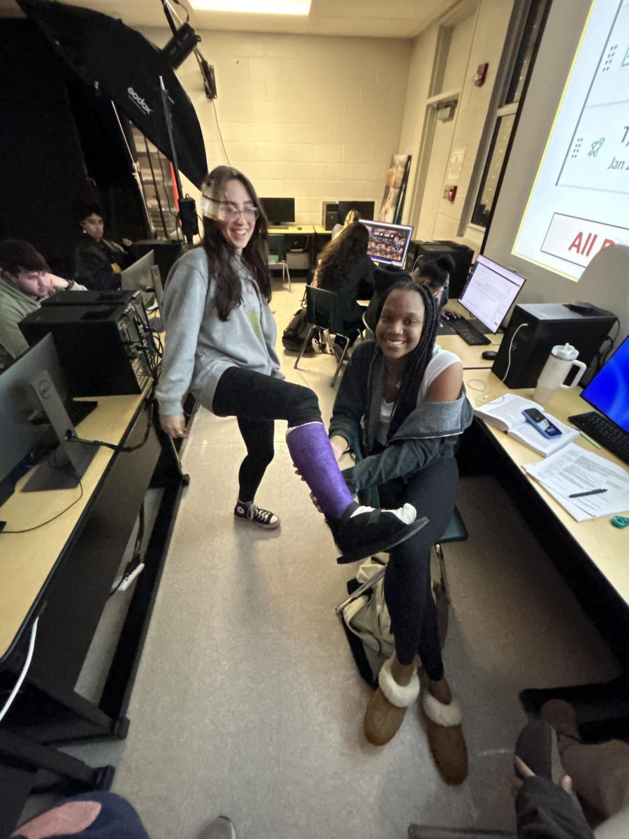 Meghan Winbley, Junior, and Anna Seidelman, Junior, having fun in Yearbook. 