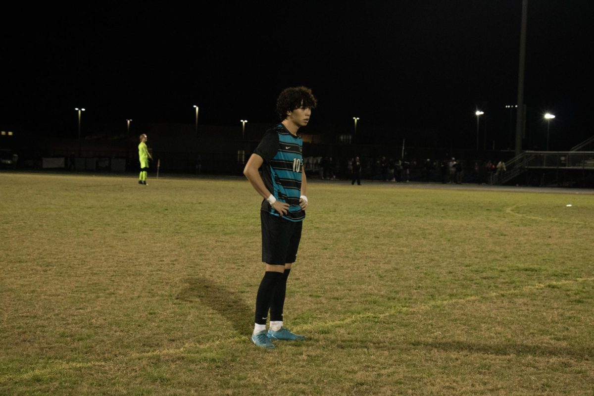 David Gutierrez standing in the field. 
