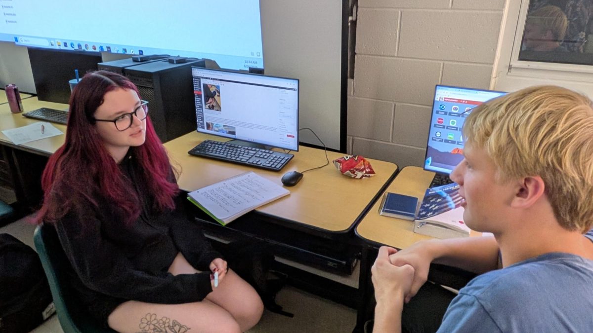 New staffer Michelle Hainault interviewing  fellow new staffer Derek Landis