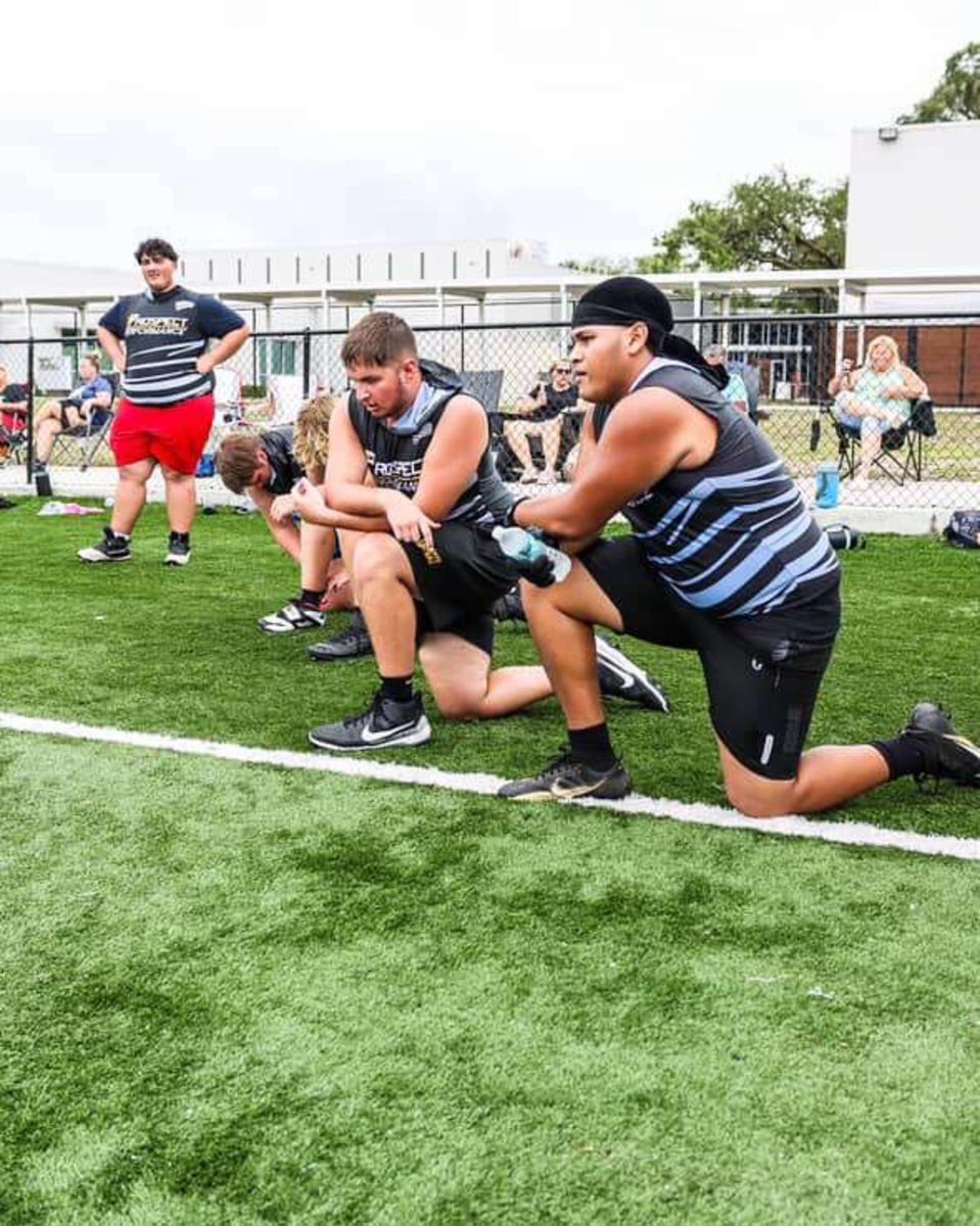 Christian Canarte taking a knee. "I was really trying to take in everything the coach was saying." Said Christian. Christian trys to improve from what the coaches observe.