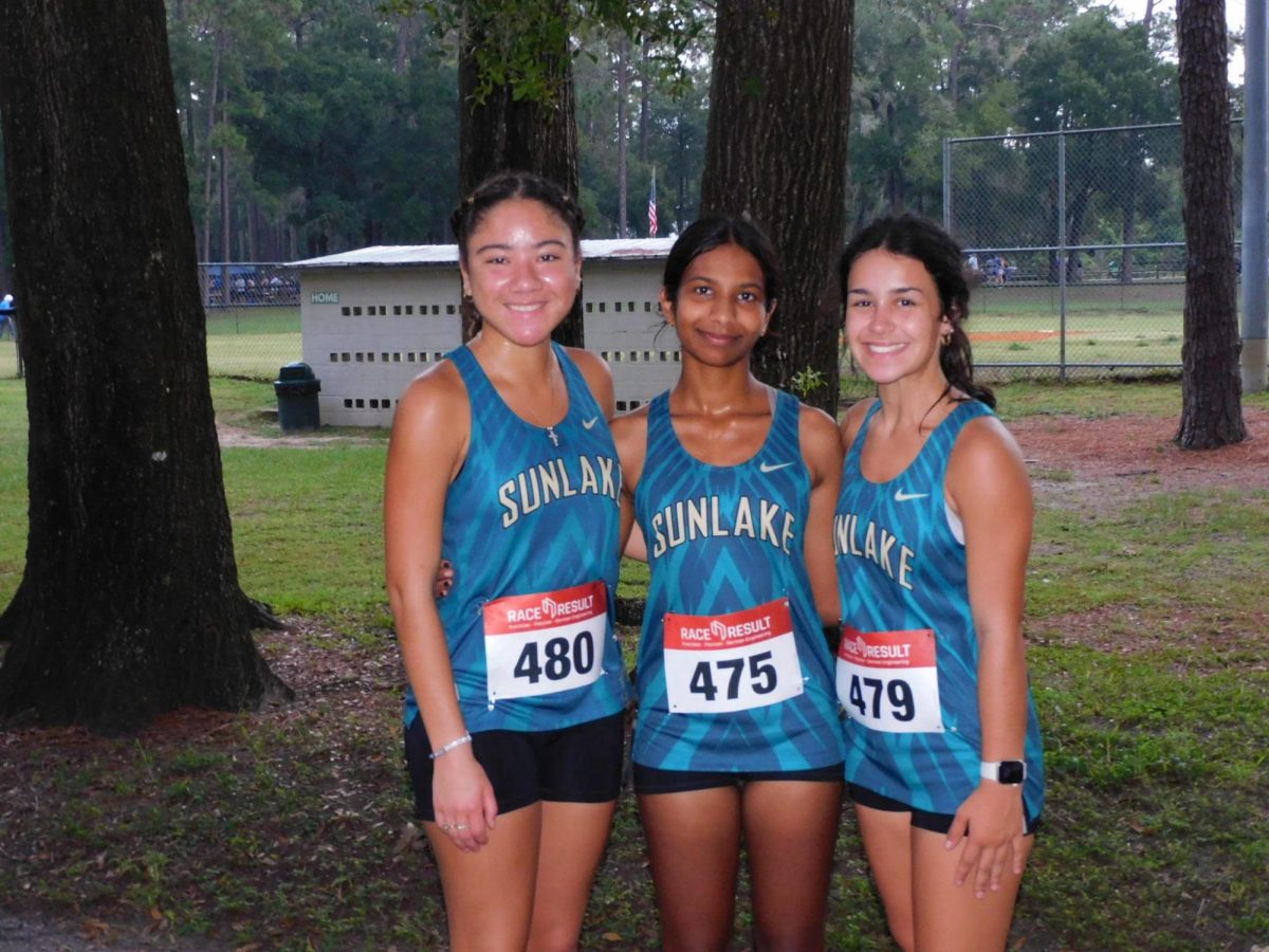 Anna Connett, Sophomore; Anna (right) at a cross country meet with her friends Harshita Anne (middle) and Alani Evan's (left)