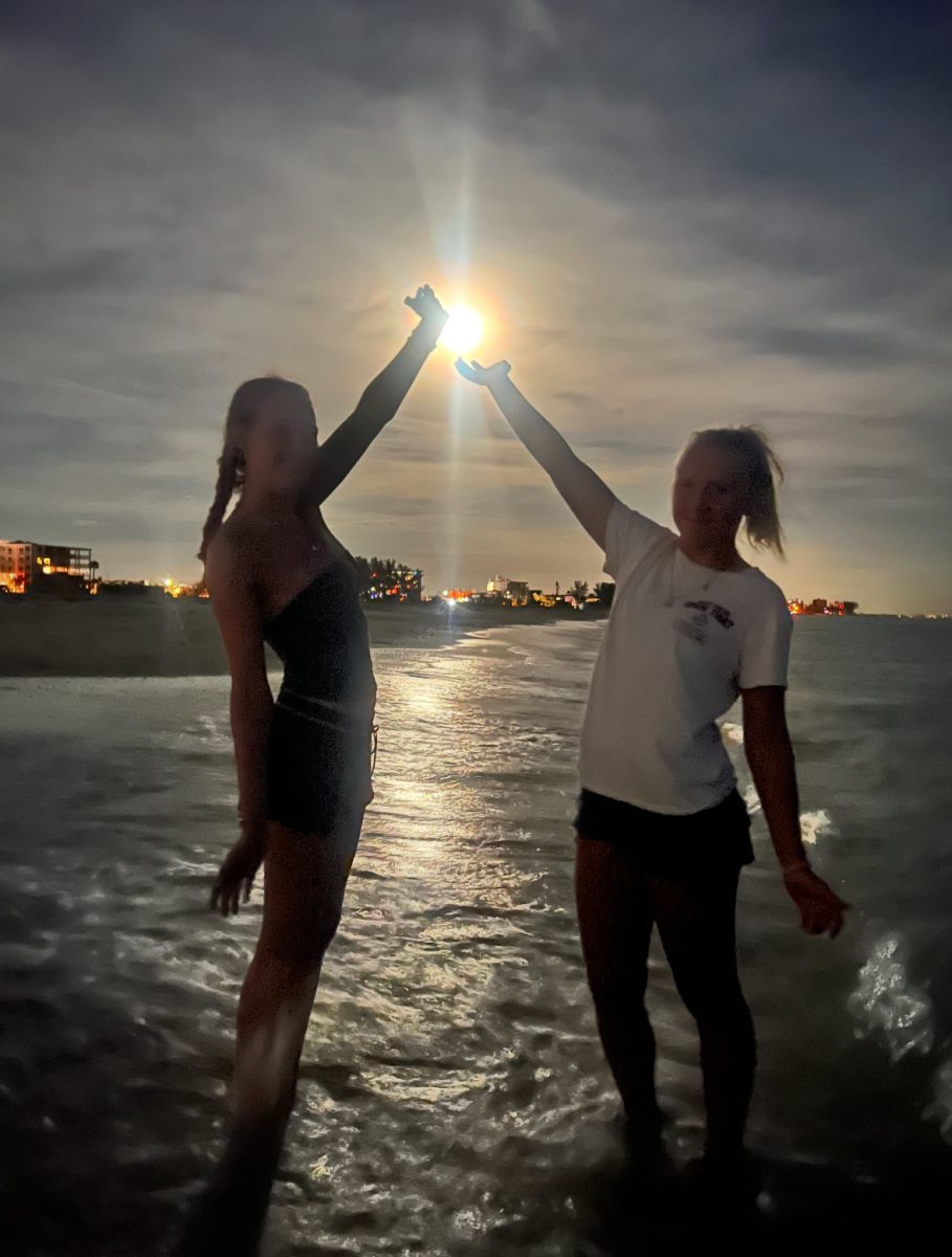 Freshman, Anna Cate Rice (Right) enjoying her time in the water at the beach.