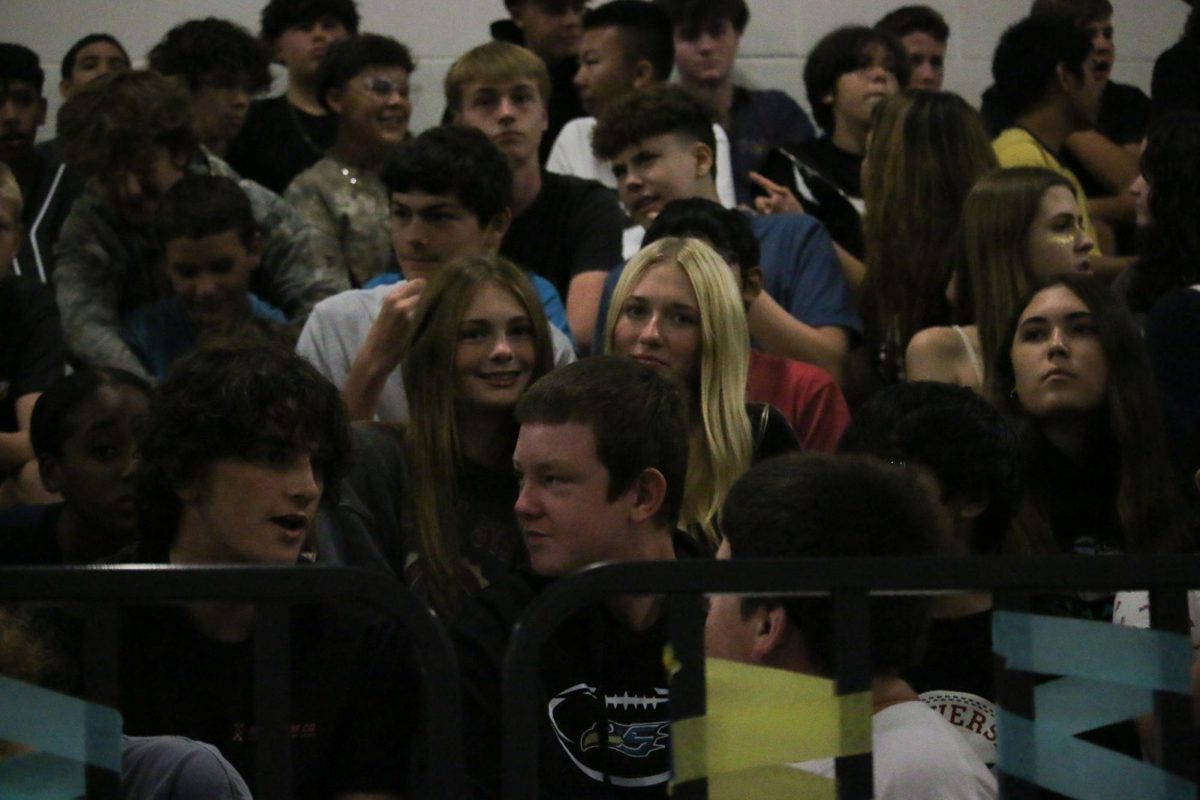 Alyssa Roberts enjoying the pep rally with her friends. She had a great view of everything by sitting in the middle.