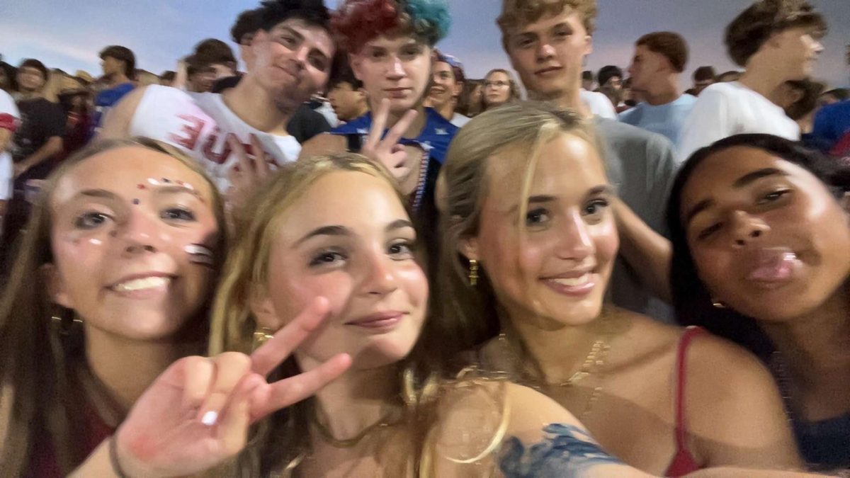 Mia Walter, Patrick Hall, Mara Crockett, Lucas Turner, Carli Diemler, Jack O'Brein, and Emily all in the student section cheering on the game!