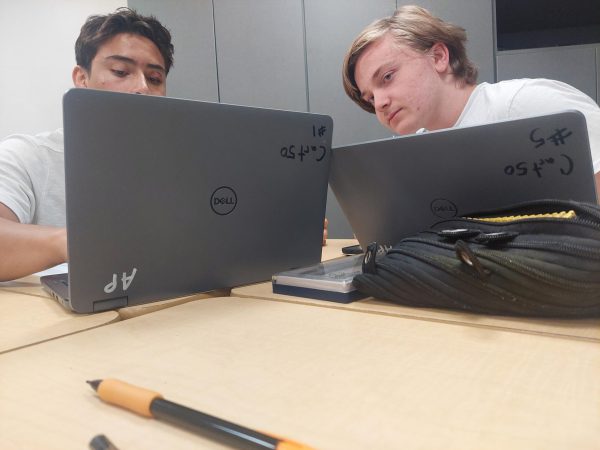 Orion (right) is helping a classmate with AP Calculus work on College Board.