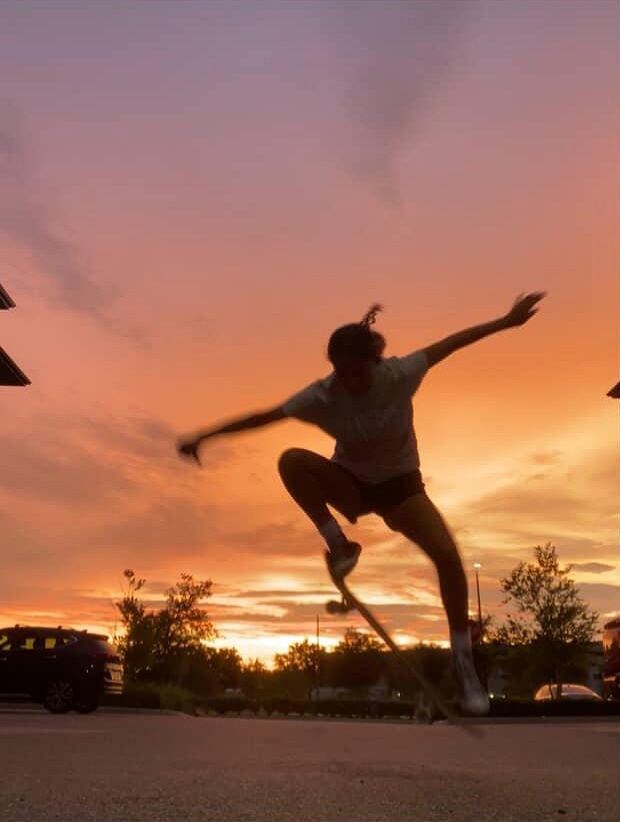 This picture captures Hannah in the middle of an Ollie, in which a skater jumps to position the nose of the board into the air. "Skateboarding calms me down, and allows me to focus on the present moment..." Hannah explains.