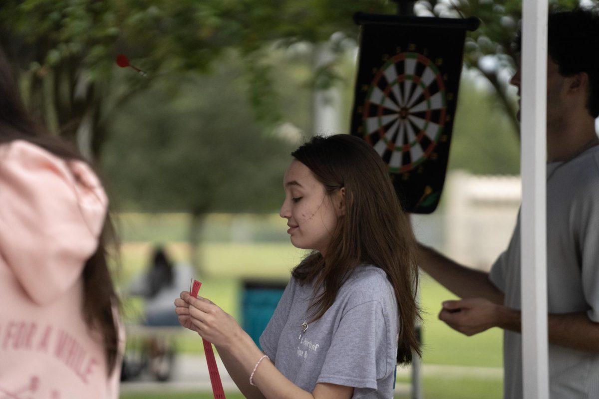 Sara Mercier, senior, enjoying Sunlake club fair with her club, First Priority.