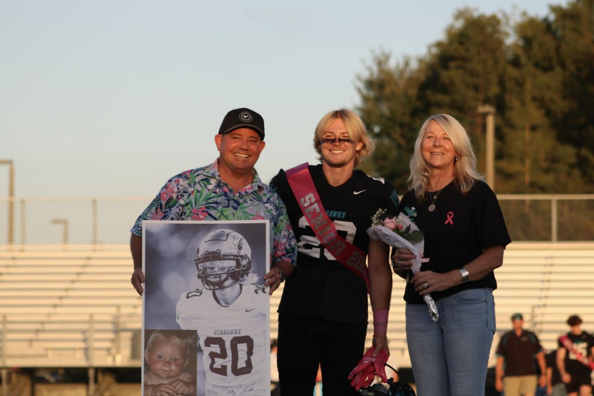 Senior Eric Travis was accompanied by his parents during his walk at senior night. Eric states, "Senior night was a lot of fun and had a great turnout".