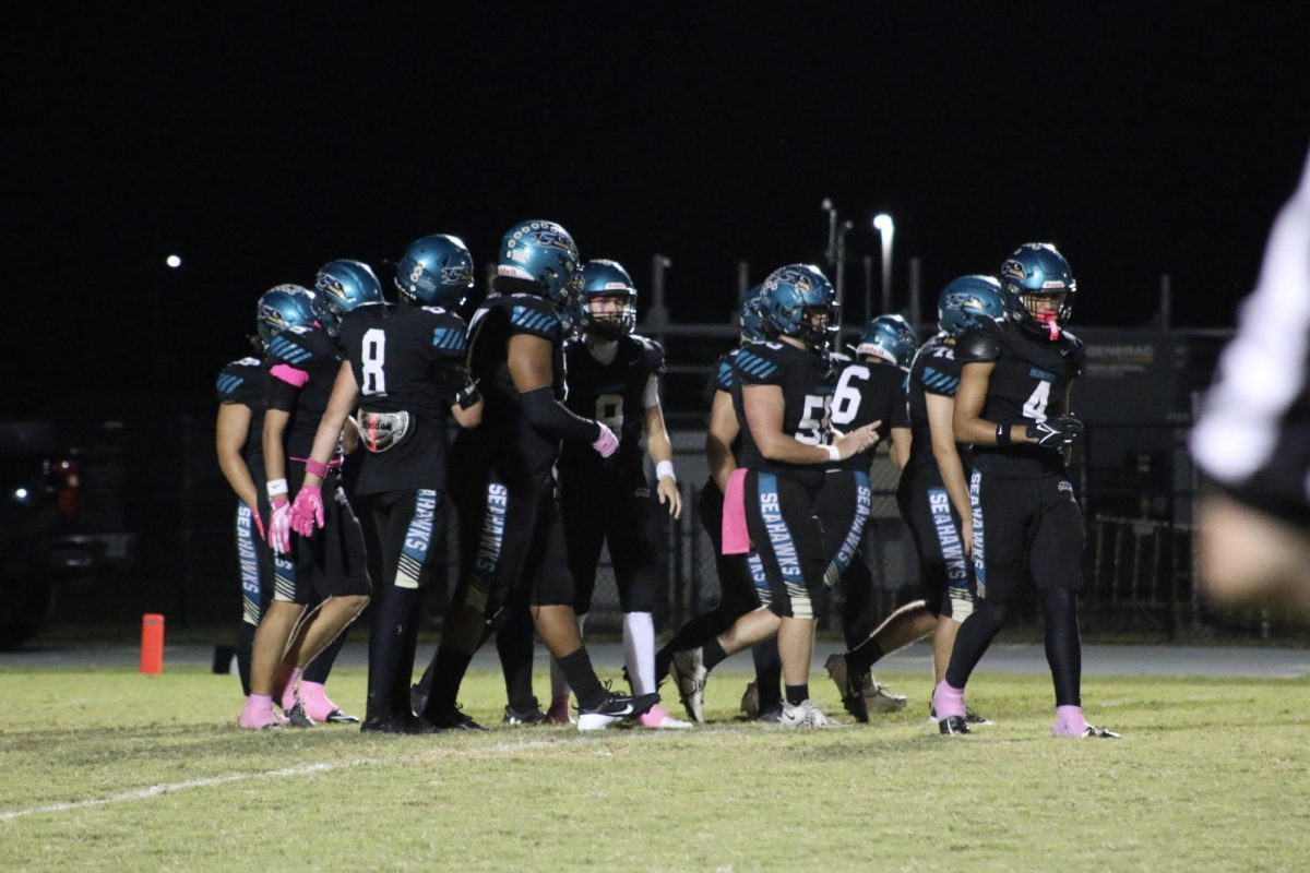 Sunlakes football team, Christin is in the middle, with the pink tape on the hand