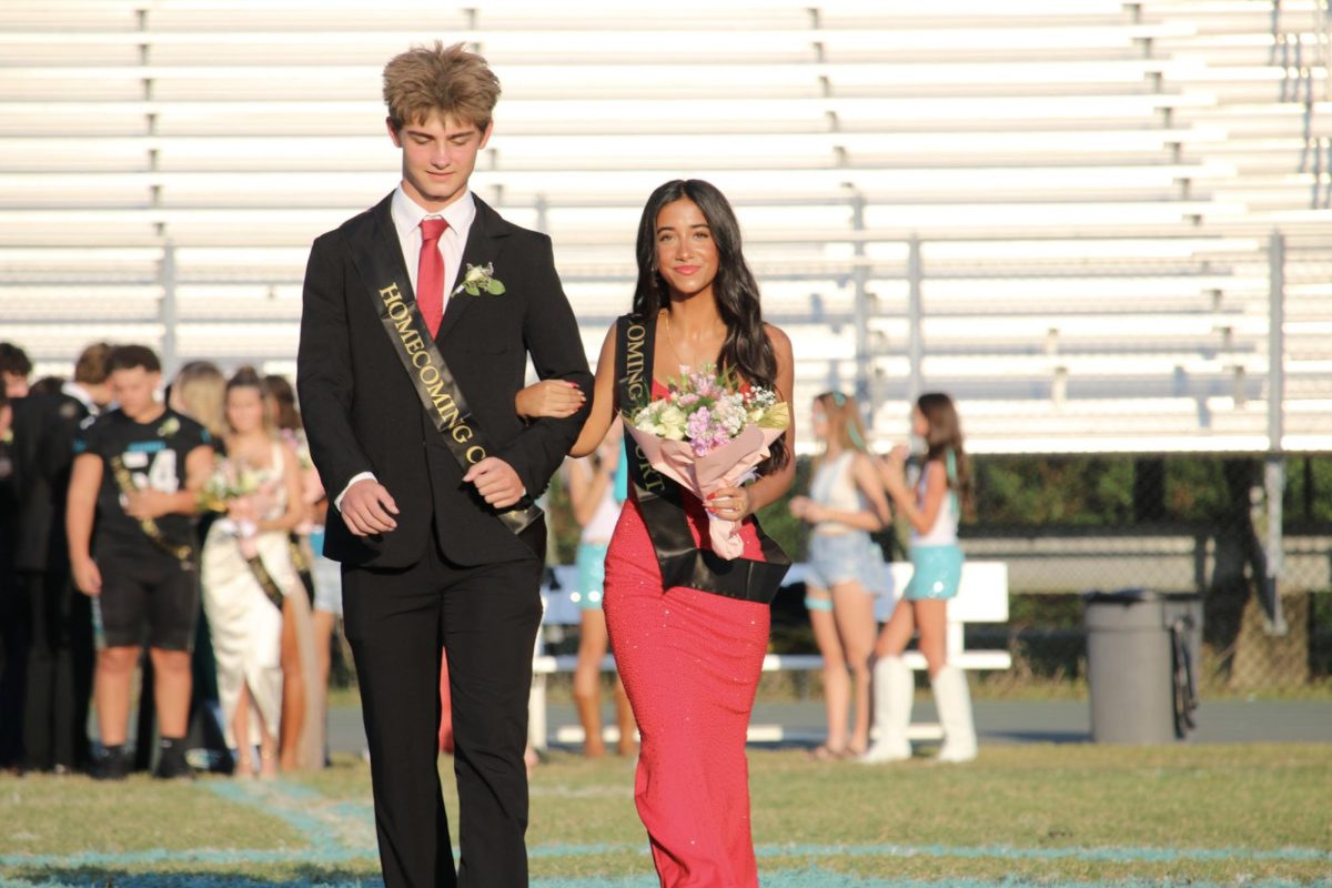 Alissa is on the left. She is walking with her boyfriend Nathan on the right. They are both juniors and looking forward to homecoming. 