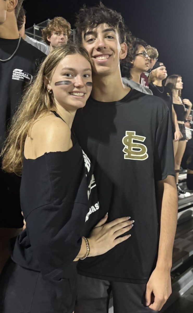This is a picture of Madison Cason and her boyfriend, Jackson Mizell. This is a picture of them at the Butter Bowl football game. Madison states, "I love getting to see all my friends at the football games."