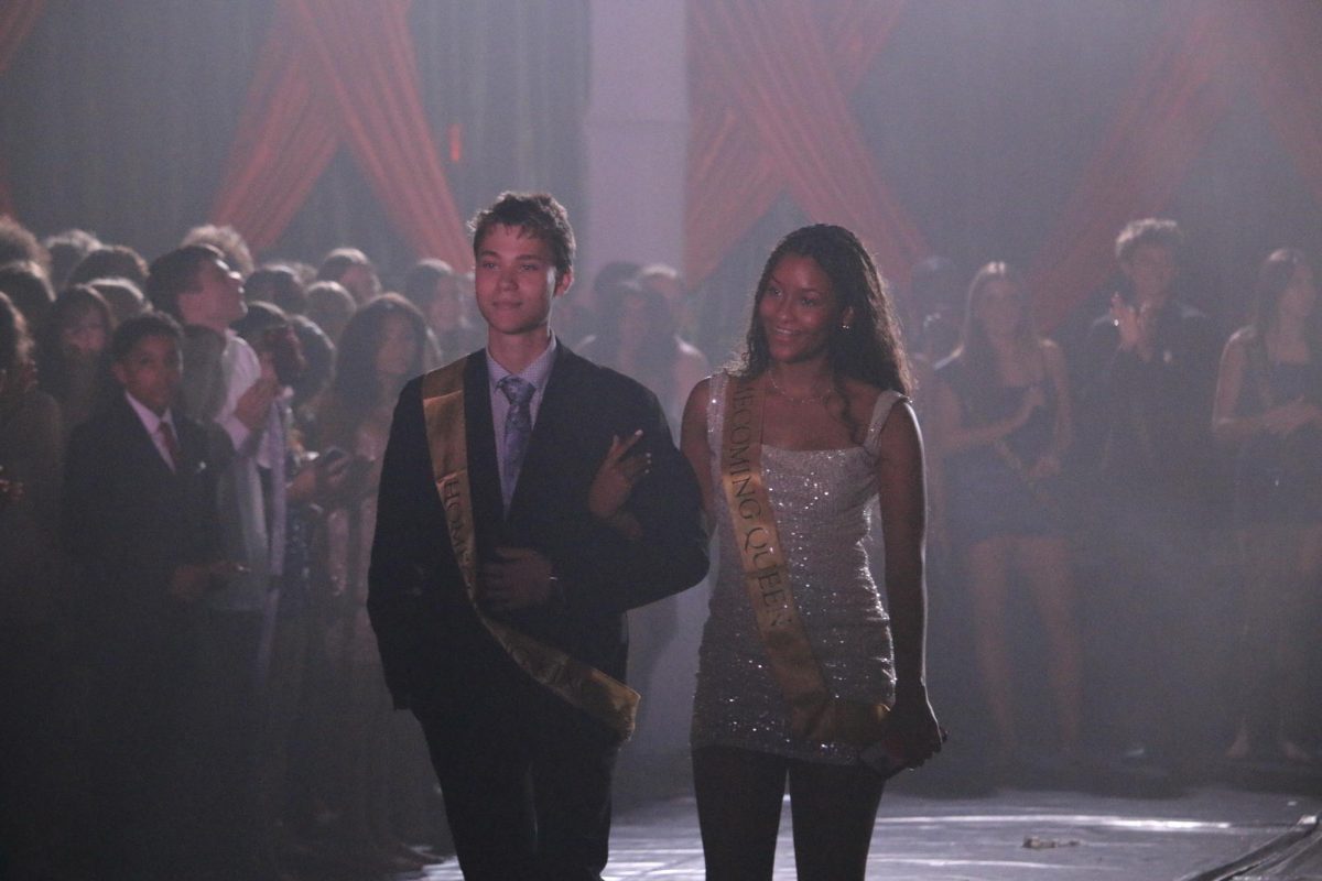 Ian Laari, senior, walking out as homecoming king during the homecoming dance at Sunlake.