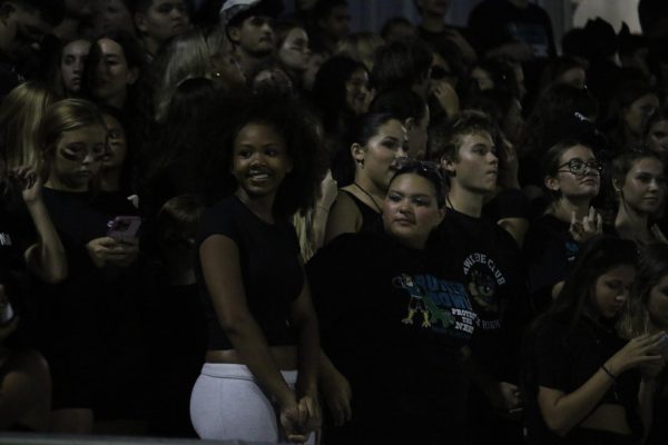 Ian Laari is a senior. He is the guy all the way to the right. He was enjoying watching the game