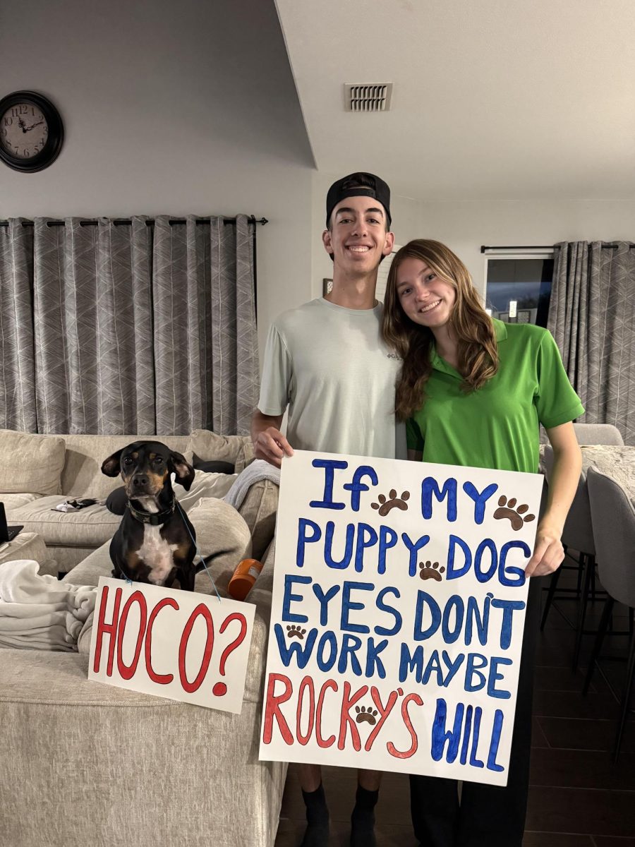 Madison Cason, senior, and her boyfriend, Jackson Mizell, during Jackson's homecoming proposal to Madison.
