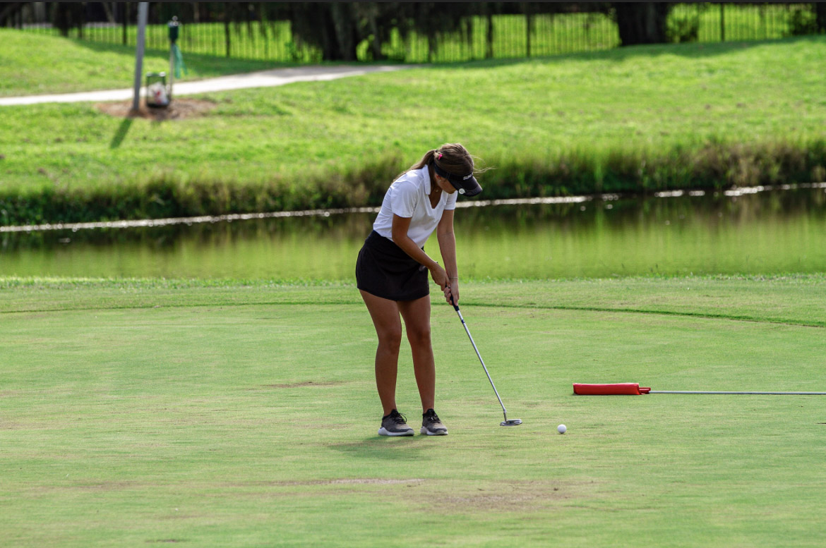 Senior, Nevaeh Airola experiencing senior night on the golf course. 