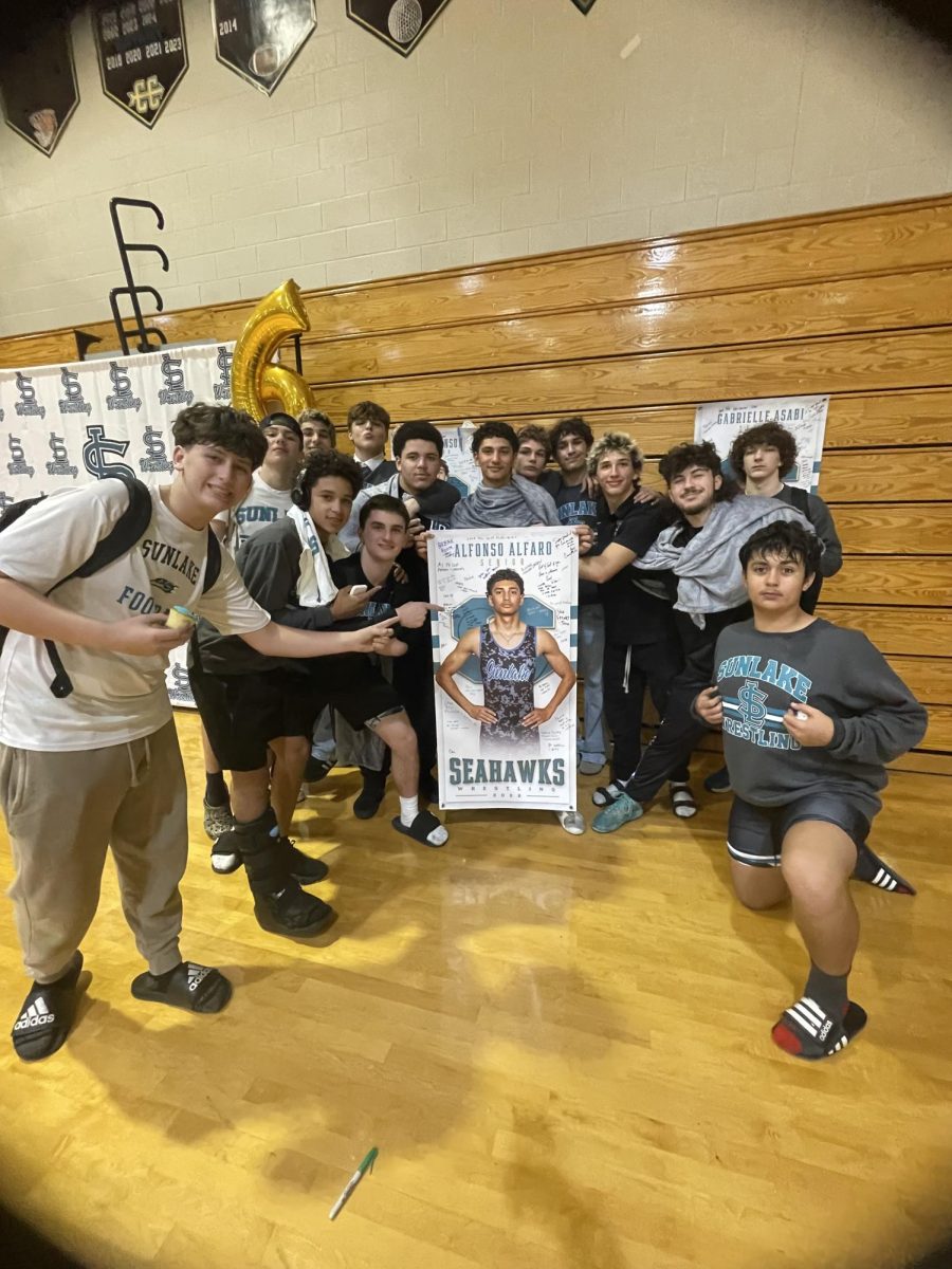 Alfonso and his teammates posing for a photo after their win.