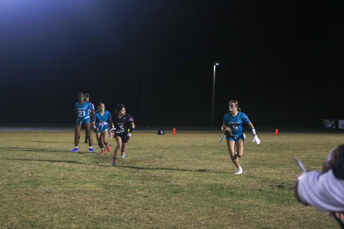 Ellie, #12, watches her teammate closely, preparing herself for anything to happen.
