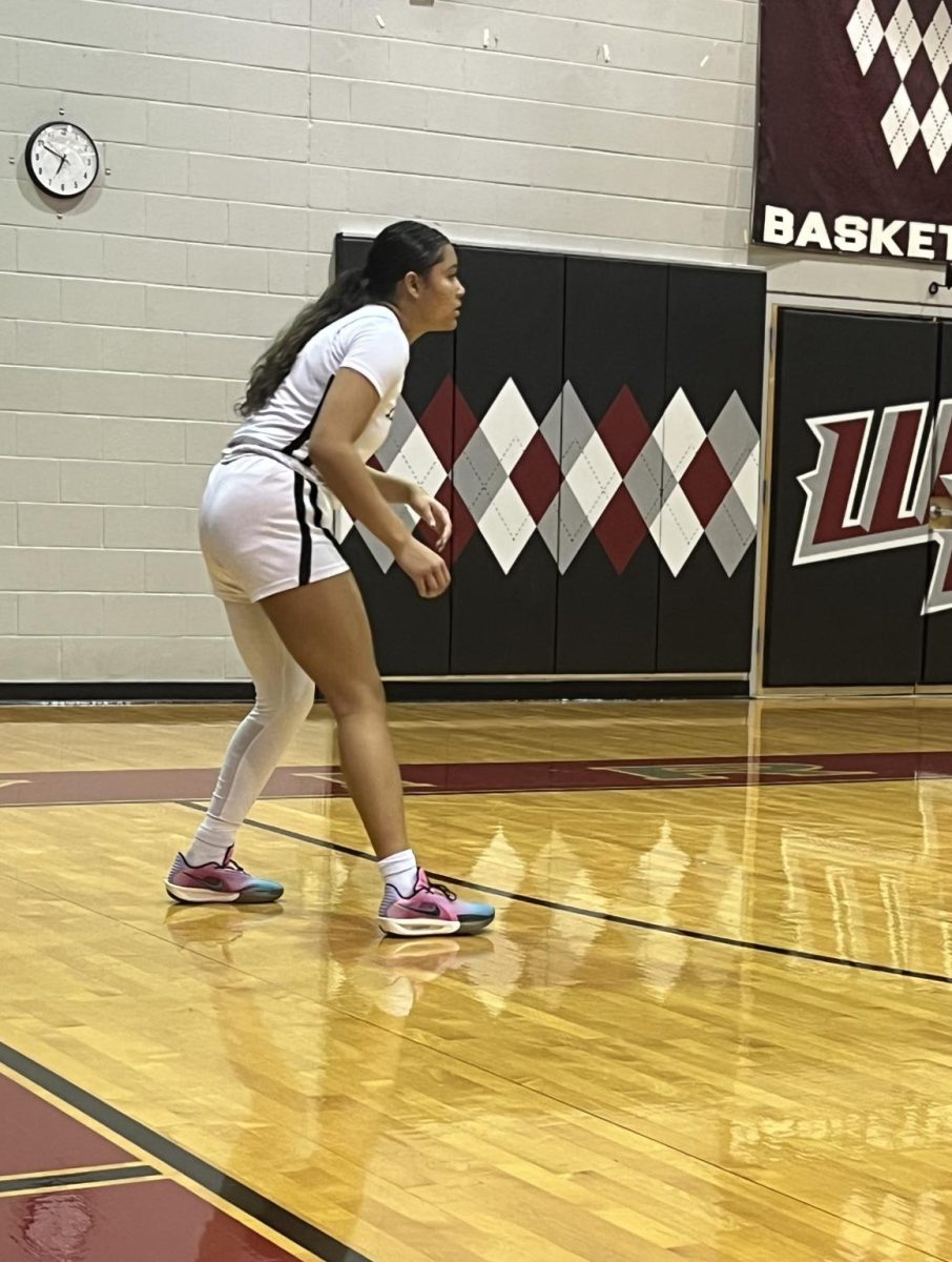 Senior Adrienne Martin stays poised and focused, bringing intensity and consistency to every possession on the court.