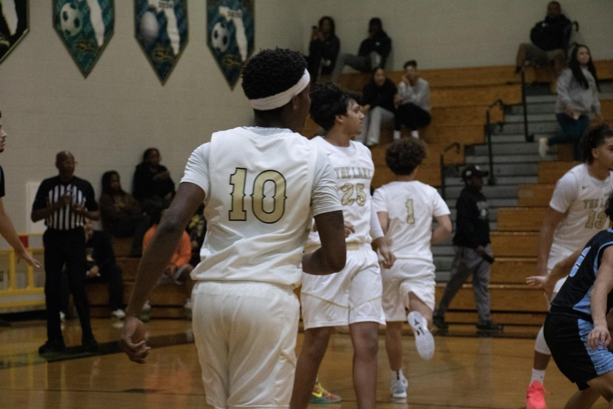 Jeremiah brown on the court at a sunlake varsity basketball game.